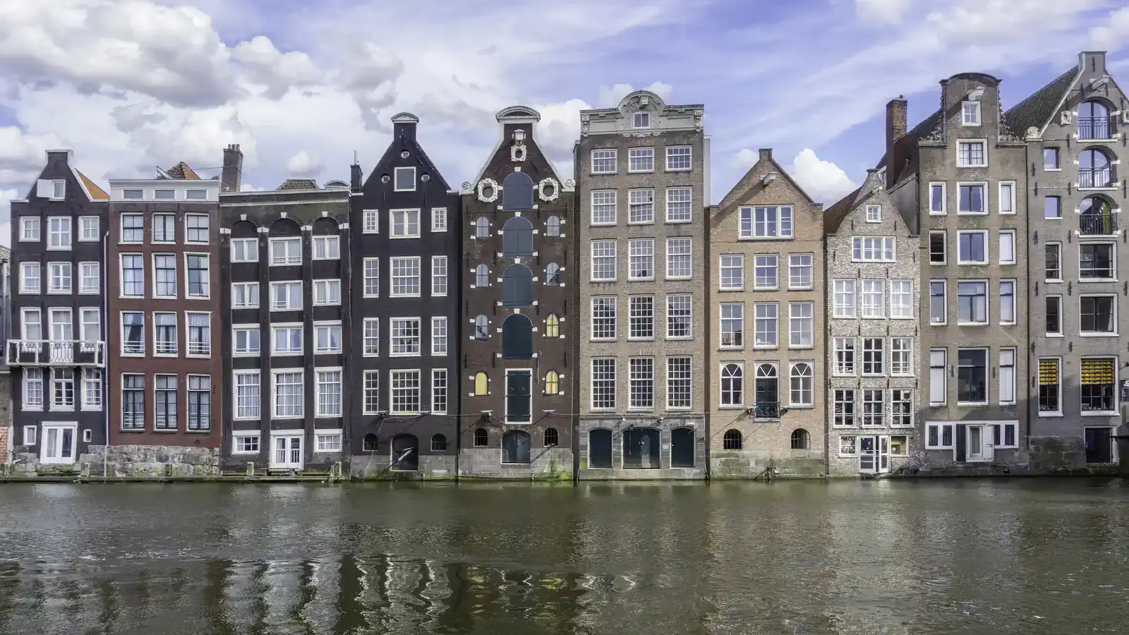 Colourful canal houses on the water in Amsterdam, for a Kadaster mortgage extract with apostille